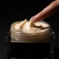 Finger dragging through shea body butter leaving deep groove, ASMR macro texture shot